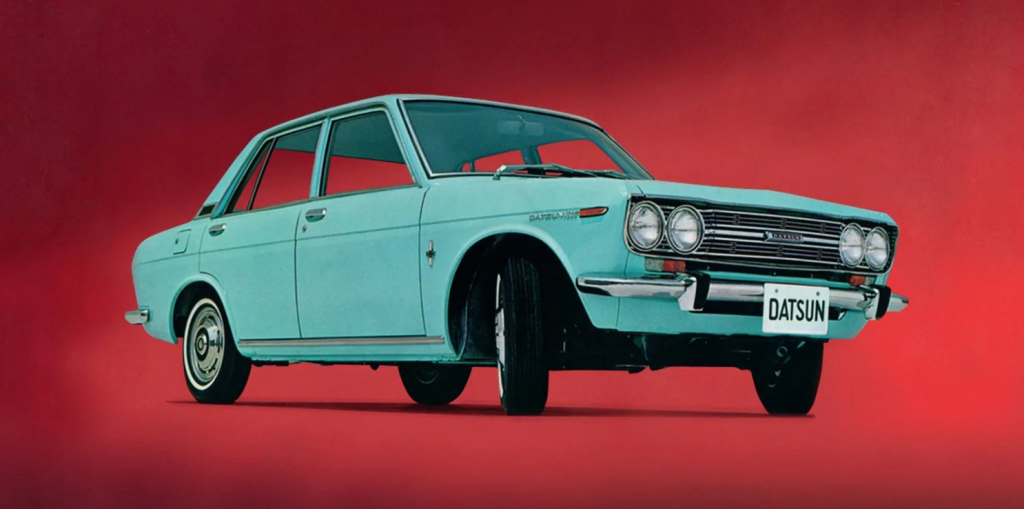 A teal 1970s Datsun/Nissan sedan