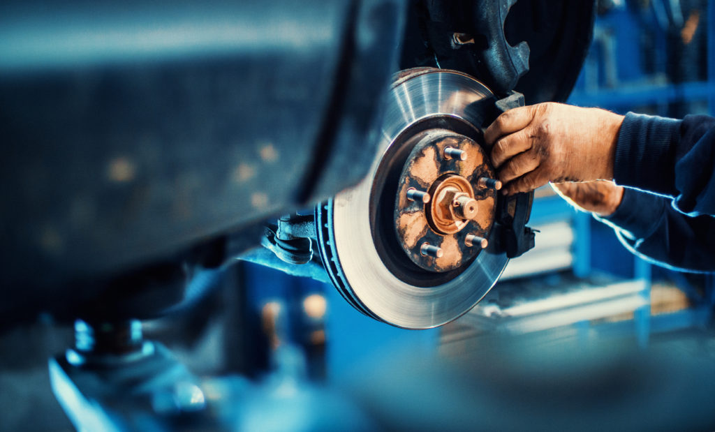 Brakes being serviced by a repair technician